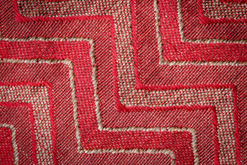 Red pattern fabric background closeup