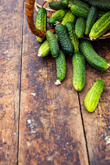 Fresh cucumber on rustic wooden background. Cucumbers are low in calories but high in many important vitamins and minerals  lose weight. leaves and flower