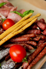Italian sliced meat with bread and tomatoes