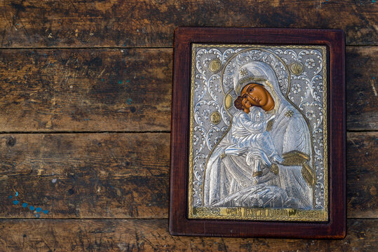 traditional orthodox icon of Mother Mary, Icon of Madonna,  Jesus, church faith concept, prayer, of Holy Mary of Magdalene, bizantine, gold background, Greece. wood table