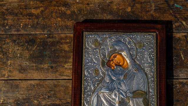 traditional orthodox icon of Mother Mary, Icon of Madonna,  Jesus, church faith concept, prayer, of Holy Mary of Magdalene, bizantine, gold background, Greece. wood table