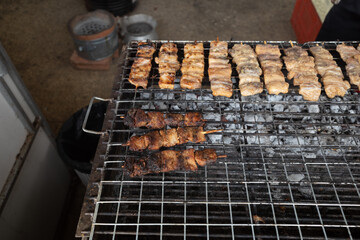 Selective focus at grill pieces of fish.