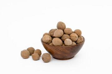 medicinal bahera or Terminalia bellericais fruits on white background 
