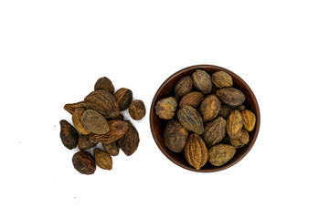 Organic Badi Harad fruit (Terminalia chebula) on  white background