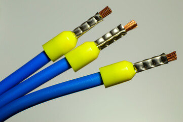 Blue wires with yellow ferrules - macro photo. Background picture. Selective focus.