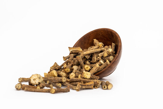 Ayurvedic herb or folk medicine Hemidesmus indicus or Nannari or Indian sarsaparilla dried roots in wooden bowl