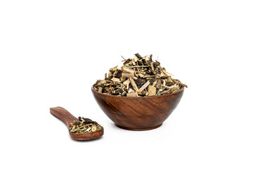 Indigofera or indigo seeds in wooden bowl isolated on white background