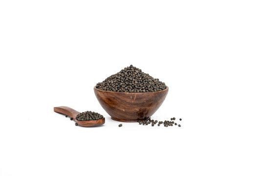 Embelia Ribes or vaividang seeds in  bowl isolated on white backgrond