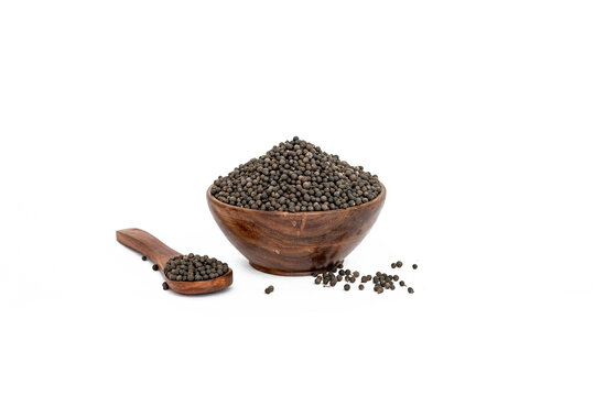 Embelia Ribes or vaividang seeds in  bowl isolated on white backgrond