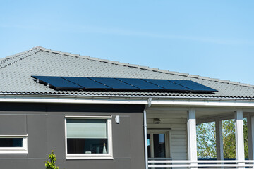 Solar cell panels mounted on the roof of a house.