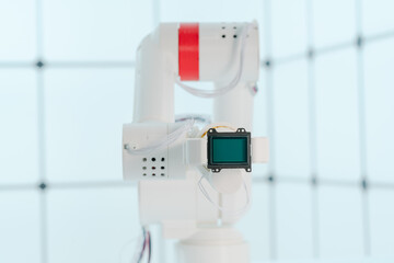 Robot arm with CCD and CMOS matrix Image sensor in the manipulator. Concept on the topic of artificial vision and pattern recognition