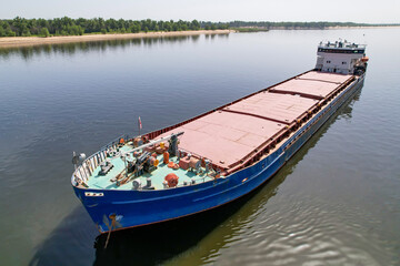 Cargo transportation. Cargo ship on the Volga river in Russia. Volga-Don shipping canal in Volgograd. Russia
