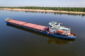 Cargo transportation. Cargo ship on the Volga river in Russia. Volga-Don shipping canal in...
