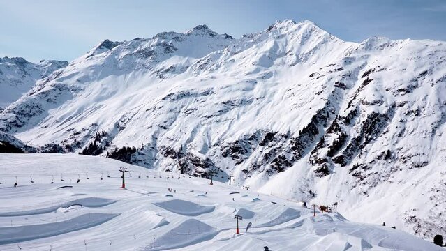 Rescue helicopter landing on the slopes helping skier in a ski park. Air ambulance in Alps. Rescue transportation.