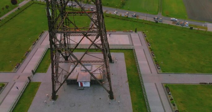 Aerial view of the wooden broadcasting tower in Gliwice with the city of Gliwice in the background. The concept of the largest wooden tower in the world. Wooden construction from a drone.