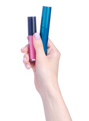 Mascara and lip gloss in hand on white background isolation