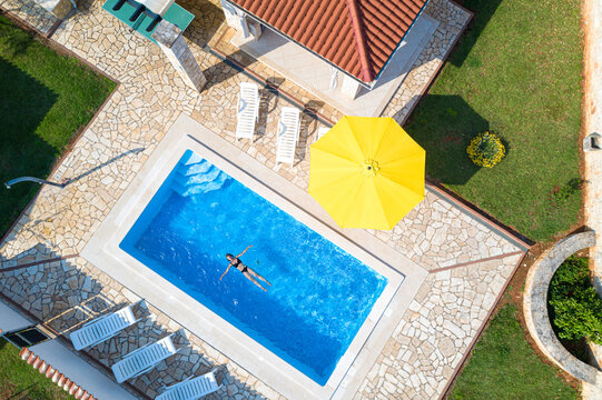 Croatia, Istria, Pula, Mother And Daughter Swimming At The Pool, Birds Eye View