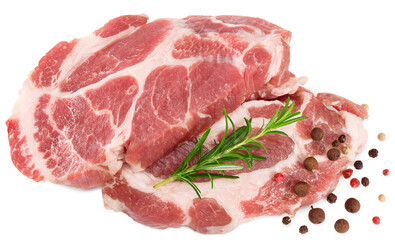 sliced raw pork meat with rosemar and peppercorn isolated on white background. Clipping path and full depth of field