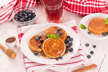 Pancakes with blueberries and chocolate cream.