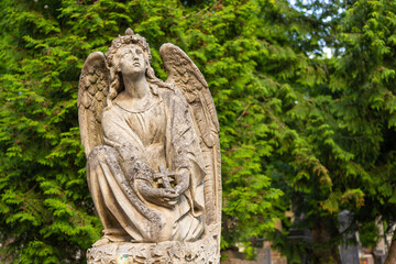 Fototapeta na wymiar Sculpture on the grave in Lychakiv Cemetery, Lviv, Ukraine.