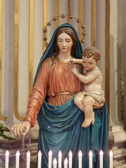 Sculpture of Madonna with Child at the Sant'Andrea della Valle Church in Rome, Italy - obrazy, fototapety, plakaty