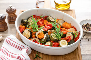Baked vegetables mix. Oven roasted carrots, onion, zucchini and bell pepper.