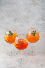 3 Great cocktail in glass with fruit on background on textured background