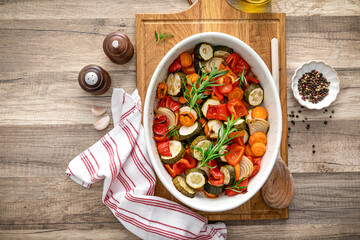 Baked vegetables mix. Oven roasted carrots, onion, zucchini and bell pepper. - 513148746