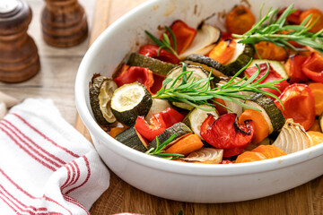 Baked vegetables mix. Oven roasted carrots, onion, zucchini and bell pepper.