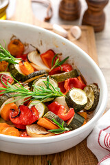 Baked vegetables mix. Oven roasted carrots, onion, zucchini and bell pepper.
