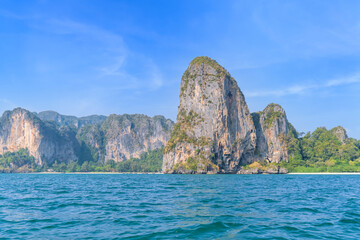 Fototapeta premium Ao Phra Nang near Railay beach with crystal clear water and exotic landmark limestone cliff mountain, Krabi, Thailand