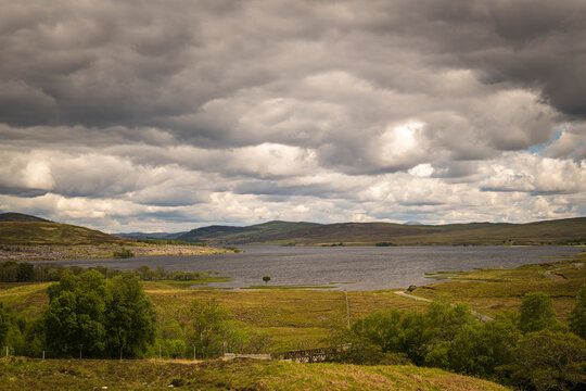 A cloudy summer landscape HDR image of Loch Naver, western end, in Mackay Country, Sutherland, Scotland