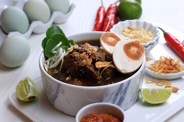Rawon, Indonesian Beef Black Soup Dish.  Black Color Made from Keluak Nut as the Main Seasoning
