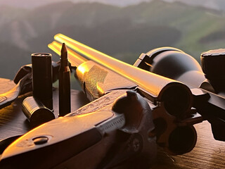 Close up of rifle  for  hunting. View from the window on sunrise.