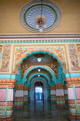 Mysore, Karnataka, India - November 25th 2018 : Beautiful decorated interior ceiling and pillars of the Durbar or audience hall inside the royal Mysore Palace. A very famous tourist attraction.