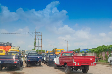 PETRAPOLE, WEST BENGAL , INDIA - JUNE 2ND 2018 : Goods carriage trucks at Indian side of international border between India and Bangladesh . Benapole is Bangladesh side.