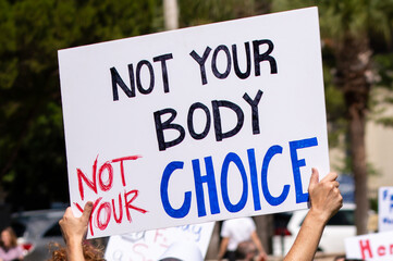 Protester Holing a Sign, "Not Your Body Not Your Choice" at the ‘Bans Off Our Bodies’ Protests Defending Abortion Rights