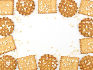 Healthy and delicious cookies and crackers. Oats and wheat on the background. copy space frame for recipes with spikelets