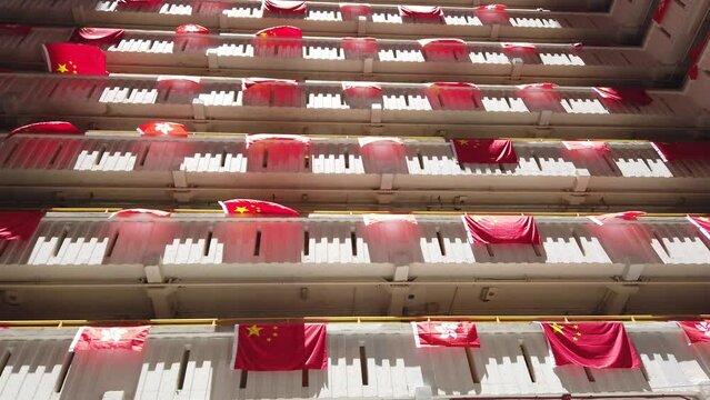 flags for celebrate the 25th anniversary of the establishment of the Hong Kong Special Administrative in Ping Shek Estate, Hong Kong
