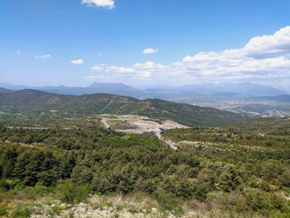 Naklejka premium Pyrenees National Park in Spain. Mountains and hills covered with green forests. View from a height of the panorama of nature.