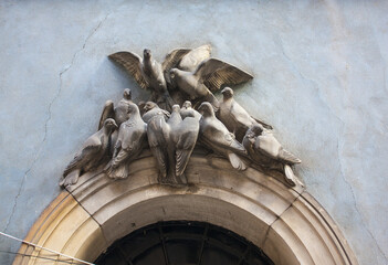 Pigeon decoration of archway above a door in Old town Warsaw in Poland