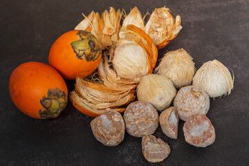 Ripe betel nut or areca nut isolated on dark background.