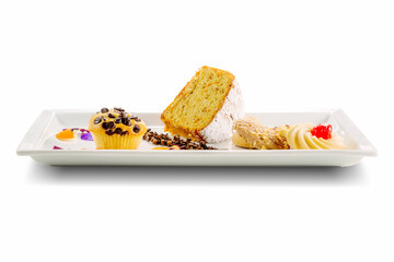 Rectangular plate with biscuits, muffins and soft carrot cake