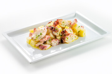 Rectangular plate with steamed octopus and potatoes © antoniotruzzi