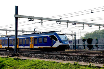 SNG CAF local commuter sprinter train at track in Barendrecht