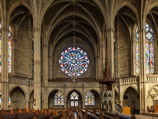 Lovely view of the left-hand transept rosette, named Martyr window, inside the Memorial Church of the Protestation in Speyer, Germany. The rose window diameter is huge with 9 meters. - obrazy, fototapety, plakaty