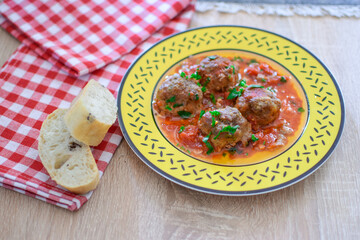 Round meatballs from Romanian traditional cuisine with bolognese sauce