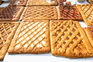large flat sweet pies filled with various jams