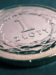 Translation: 1 zloty. Fragment of Polish one zloty coin close-up. National currency of Poland. Tinted vertical illustration for news about economy or finance. Macro