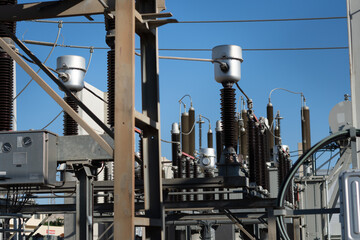 Porcelain insulators in high voltage electrical substation.